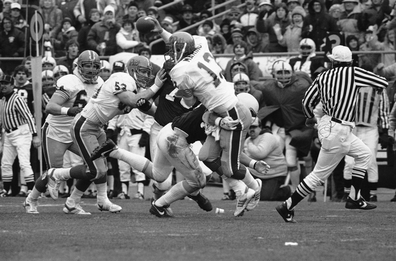 Dan Marino is hit by Penn State LB Ken Kelley in the 1982 matchup. Rusty Kennedy/AP Images